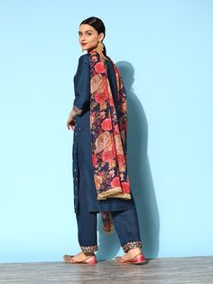 PRODUCT DETAILS Content - 1 Kurta, 1 Trouser, & 1 Dupatta Kurta Fabric -Silk Blend Trouser Fabric -Silk Blend Dupatta Fabric -Organza Colors -Blue & Gold Prints & Patterns -Polka Dot Print & Yoke Embroidery Necklines -Round Sleeve Styles -Three-Quarter Sleeves with Hem Length - Calf Length Fit -Regular Fit Size & Fit: Tailored to Perfection:The model wears a size S with the following measurements:Chest: 32"Waist: 28"Hips: 33"Height: 5'8" Please check the last image above for a complete size char Semi-stitched Silk Palazzo Set With Floral Print, Festive Silk Kurta With Floral Print, Silk Churidar With Sheer Dupatta For Navratri, Silk Palazzo Set With Floral Print In Traditional Drape, Silk Palazzo Set With Floral Print And Traditional Drape, Silk Traditional Wear With Sheer Dupatta And Long Sleeve, Silk Churidar For Navratri, Festive Silk Palazzo Set With Floral Print, Semi-stitched Silk Palazzo Set For Navratri