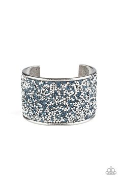 A brilliant collision of glassy blue and metallic silver rhinestones are encrusted across the front of a thick silver cuff, creating a stellar sparkle. Sold as one individual bracelet. Silver Sparkling Crystal Bangle Bracelet, Adjustable Silver Cuff Bracelet With Rhinestones, Silver Adjustable Cuff Bracelet With Rhinestones, Adjustable Silver Bedazzled Jewelry, Glamorous Silver Sparkling Crystal Bracelet, Glamorous Sparkling Silver Crystal Bracelet, Silver Adjustable Bling Cuff Bracelet, Adjustable Silver Bling Cuff Bracelet, Silver Bling Adjustable Cuff Bracelet