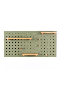 a peg board with two wooden handles and some holes on it