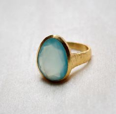 D E T A I L S - Material: 925 Sterling SilverStone: Aqua ChalcedonyThe fit: True to US ring size Finish: Textured and Gold Plated to a high shineUpgrade your accessory collection today with this must-have piece, & flaunt your style statementS H I P P I N G & P R O D U C T I O N - My current production time is 2-6 business days, which means after those days are up, your order ships! I make everything custom to order, by hand, but I promise you it's worth the wait!R U S H - M Y - O R D E R Formal Handmade Chalcedony Rings, Handmade Chalcedony Rings For Weddings, Oval Chalcedony Wedding Rings, Handmade Chalcedony Rings For Anniversary, Oval Chalcedony Rings For Anniversary, Aqua Chalcedony Ring, Chalcedony Ring, Textured Ring, Aqua Chalcedony