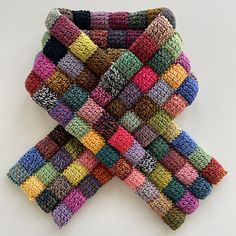 multicolored knitted scarf on white background