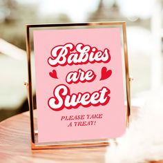 there is a sign that says babies are sweet please take a treat on the table