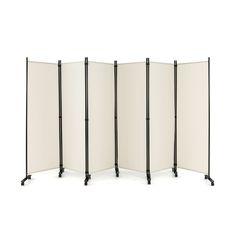 four - panel room divider with white canvas panels and black metal legs, on an isolated background