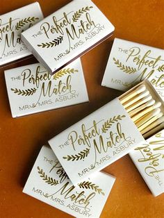 matchboxes with gold foil on them sitting next to matchesticks that say the perfect match