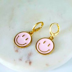 Pink Round Smiley Face Earrings. Huggies Earrings, Material Zinc Alloy And Enamel. 1.25 Length .4 Width Playful Pink Round Earrings, Pink Fun Dangle Jewelry, Fun Pink Dangle Jewelry, Trendy Pink Earrings, Trendy Pink Dangle Jewelry, Trendy Pink Hypoallergenic Earrings, Trendy Hypoallergenic Pink Earrings, Trendy Pink Round Hoop Earrings, Trendy Pink Hypoallergenic Jewelry