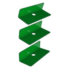 three green plastic shelves with holes in the middle and one on each side, all facing different directions