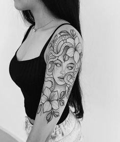 a woman with a tattoo on her arm