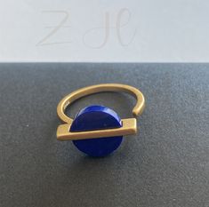 - Materials: 925 Sterling Silver  --Plating: plating Gold  -Color: gold  -Ring size: adjustable -gemstone:Natural mother of pearl &Natural Lapis lazuli  -Ring Dimension: Length Approx 12mm -Lapis lazuli ring,Minimalist Stone Ring,Mother of Pearl Rings,Sterling silver ring gold plated,Adjustable Ring for Women,gift for mom  We are able custom make, please kindly let me know if you would like to do custom make! -These handmade beautiful geometric ring, lapis lazul,mother of pearl are genuine, natu Gold Adjustable Ring, Adjustable Blue Brass Ring, Modern Midi Rings As A Gift, Modern Round Midi Rings As Gift, Modern Handmade Midi Rings As Gift, Adjustable Modern Brass Midi Rings, Modern Adjustable Brass Midi Rings, Adjustable Midi Rings For Gifts, Adjustable Midi Rings As Gift