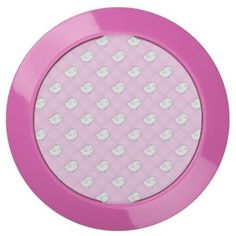 a pink plate with white hearts on it