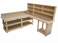 a wooden desk with shelves on each side