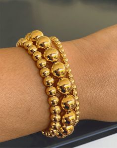 "Adjustable Slider Bracelet with 6mm Beaded Balls in 18k Gold-Filled We offer this item in Two finishes : Gold and Silver (White Rhodium) .Product Specification: Clasp Type : Adjustable (Elastic) Length in inches / cm : 9\" / 21cm Weight in Oz : 0.20 Finish : Gold Filled 18k" Bracelet Bead, Gold Bead Bracelets, Solid Gold Jewelry, Blue Style, Jewelry Cleaner, Gold Filled Jewelry, Gold Beads, Base Metal, Statement Jewelry