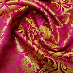 a pink and gold brocaded fabric