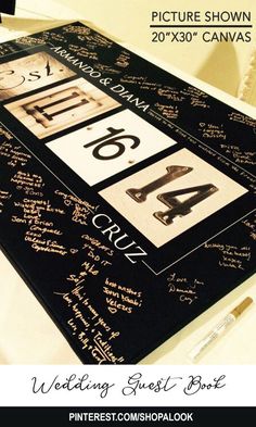 the table has been decorated with black and white writing on it, along with several other items