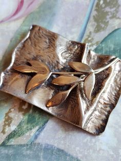 This is a vintage, sterling silver with a gold wash, Golden Wreath Society of Major Donors, Hadassah, 1999 brooch (you can use it as a pendant as it has a hanging loop as well). It has a branch with leaves on it. This is marked and has tested positive for sterling silver. The piece measures: a hair over 2.25 x a bit over 1.5 inches. Don't forget to stop in at my other Etsy shop... http://www.etsy.com/shop/xtdesigns. Follow me on Twitter at... MyYiayiaHadThat@MyYiayiaHadThat. If you have a wish l Gold Sterling Silver Brooch For Anniversary, Gold Sterling Silver Brooches For Anniversary, Antique Gold Sterling Silver Brooch, Antique Gold Sterling Silver Brooches, Artisan Gold Brooches For Gifts, Golden Wreath, Branch With Leaves, Gold Wash, Vintage Sterling Silver