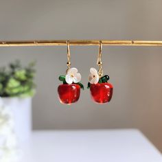 Our snow-white inspired big red glass transparent apple earrings are made with glass apples, acrylic flowers, 14K gold plated and 925 silver plated hooks which are good for delicate ears. Size: approx. 0.55" wide and 1.7" long Snow White Accessories, Big Apple New York, Apple Fashion, Apple Earrings, Apple Gifts, Dangle Earrings Wedding, Glass Transparent, Fruit Earrings, White Accessories