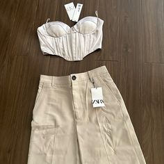 Zara Wide Leg Cream Pants And Cropped Top Fitted Khaki Sets With Pockets, Beige Fitted Wide Leg Set, Chic Beige Sets With Pockets, Beige Sets With Pockets, Fitted Khaki Sets For Spring, Zara Fitted Khaki Bottoms, Fitted Khaki Bottoms From Zara, Fitted Khaki Zara Bottoms, Fitted Zara Khaki Pants