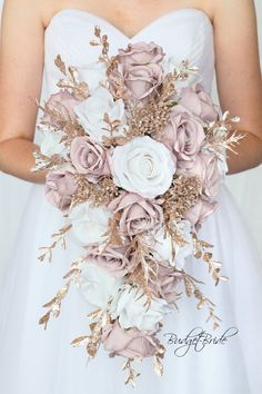 a bridal bouquet with white and pink flowers