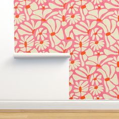 a pink and white wallpaper with flowers on it