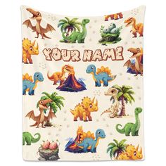 a blanket with dinosaurs on it that says, your name is in front of them