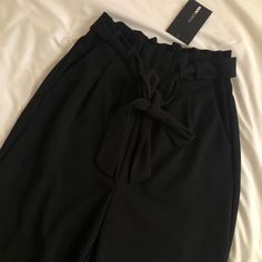 Size Xs Brand New With Tag Serious Inquiries Only ! Elegant Black Bottoms With Tie Waist, Black Wide Leg Pants With Tie Waist, Black Wide-leg Pants With Tie Waist, Chic Paperbag Waist Pants For Night Out, Chic Black Pants With Tie Waist, Chic Black Tie Waist Pants, Spring Paperbag Waist Bottoms For Night Out, Spring Night Out Bottoms With Paperbag Waist, Elegant Paperbag Waist Bottoms