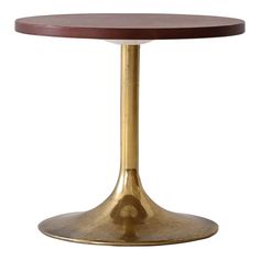 a round wooden table with gold metal base