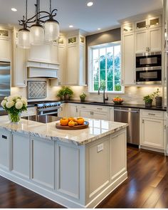 a large kitchen with white cabinets and marble counter tops, along with an island in the middle