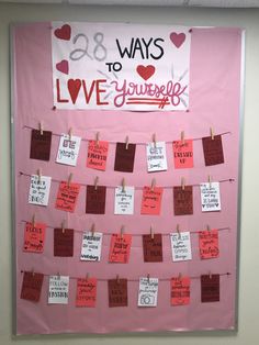 a bulletin board with notes pinned to it that says, 28 ways to love yourself