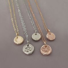 "A tiny pendant with a texture like stone. The pendant measures about a quarter of an inch or slightly larger. The pendant may be purchased separately. Chain choices include lengths of 16\" or 18\" and two chain styles, a delicate 7 mm twist cable chain or a sturdy 1.2 mm rolo chain. Chains and charm are made of solid 14k rose gold. Versatile and perfect for every day if worn alone, this necklace also combines well with other chains and charms. May be ordered with symbols and letters, and the pe Ohm Pendant, Lotus Symbol, Rose Gold Initial, Pebble Pendant, Pebble Necklace, Tiny Pendant, A Symbol, Necklace Personalized, Rolo Chain