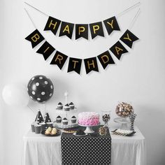 a birthday party with black and white decorations