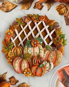 a table topped with pumpkins and other decorations