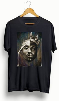 This is a custom 2Pac | Biggie Custom T-Shirt. Please view photos for size chart. Message us for custom colors or styles. Features • 5.3 oz., 100% preshrunk cotton • Double-needle sleeve and bottom hems •Taped neck and shoulders•Classic midweight fabric•Classic fit tubular body •7/8" collar•Classic fit•Tear-away labelCare:Machine wash cold inside out. Hang dry or low dry. Never iron directly on graphic. Cotton Tops With Custom Artwork For Streetwear, Black Cotton Tops With Custom Artwork, Casual Black T-shirt With Custom Artwork, Fan Merchandise T-shirt With Custom Artwork And Crew Neck, Crew Neck T-shirt With Custom Artwork For Fans, Band Merch T-shirt With Custom Artwork For Streetwear, Black Custom Print Fan T-shirt, Black Custom Print Fan Apparel T-shirt, Black Custom Print T-shirt, Fan Apparel