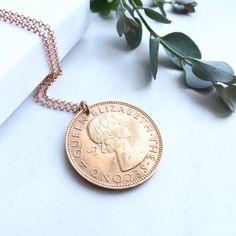 This 60th necklace is handmade using a  genuine New Zealand copper (zinc and tin) lucky penny from 1959.It would make an exquisite gift for your loved one. The coin has been cleaned and polished by hand and is highly detailed. The penny hangs from a rose gold vermeil jump ring and rose gold vermeil  24inch (length) rolo chain with a ring spring fastening as shown.The rose gold vermeil chain matches the coppery penny perfectly in colour and retains a soft warmth that sits well with any skin tone. Rose Gold Coin Pendant Necklace, Rose Gold Pendant Necklace With Vintage Charm, Anniversary Rose Gold Necklace With Vintage Charm, Rose Gold Medallion Necklace For Anniversary, Gift Coin-shaped Necklace With Large Pendant, Rose Gold Coin Pendant Charm Necklace, Rose Gold Coin Pendant Jewelry, Rose Gold Round Coin Pendant Jewelry, Classic Rose Gold Medallion Necklace