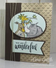 a close up of a card with an animal and giraffe design on it