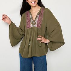 This breezy boho-inspired women's split crew neck blouse by Frye and Co. is perfect for the office or weekend drinks. Made from a woven blend, this relaxed-fit top has an embroidered yoke, a split tie neck and billowing 3/4 flutter sleeves. Wear it with tailored pants or skinny jeans to balance the silhouette. Features: EmbroideredClosure Type: Pullover HeadFit: Relaxed FitNeckline: Split Tie NeckSleeve Length: 3/4 SleeveSleeve Style: Flutter SleeveFiber Content: 100% RayonCare: Machine Wash, T… Green Blouse, Tailored Pants, Shop Blouses, Tie Neck, Flutter Sleeves, Flutter Sleeve, Workout Tops, Neck Tie, Sleeve Blouse