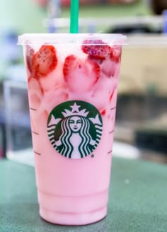 a starbucks drink with strawberries and ice