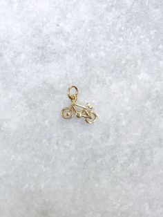 Looking for an adventure? Our bicycle charm is the perfect way to capture your whimsical side, or gift more than just jewelry to a loved one. Gift a cherished memory or a goal that you share. Our bicycle charm represents Travel. Whimsy. Self-sufficiency. Endurance. Spontaneity. Dainty 10mm diameter Material: Pure 925 Sterling Silver Finish: Silver or 18K gold Add our delicate curb chain or one of our classic lockets to your order and we will put the charm on for you! Closed jump ring so it will never fall off Add it easily to a necklace you already love Curb chain: https://www.etsy.com/listing/1413342241/gold-curb-chain-16?click_key=2a87eec29bf05ef2bf3aa5241643c953da775e6e%3A1413342241&click_sum=6b9e82d1&ref=shop_home_active_2&sts=1 Lockets: https://www.etsy.com/shop/MyRosalyn?ref=simple-s Gold Charm Necklaces For Everyday, Whimsical Nickel-free Charms For Gifts, Locket Necklace, Curb Chain, Jump Rings, Gold Vermeil, Locket, Charm Necklace, 18k Gold