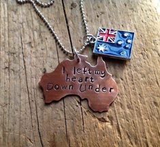 a necklace with an australian flag and the words i let my heart down under