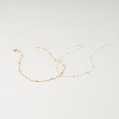 Minimal and modern, our satellite bracelet is perfect for layering. Single, double layered or matched with your other bracelets will make a statement for any occasion. P R O D U C T * D E T A I L S - Wire wrapping detail - Available in Sterling Silver, 14k Gold Filled or 14k Rose Gold Filled L E N G T H - Model is wearing Gold bracelet - This bracelet is measured opened from end to end - Not sure what length to get? Step 1: Use a string to mark the spot you would like your bracelet Step 2: Measu Dainty Beaded Bracelets With Satellite Chain, Dainty Beaded Bracelet With Satellite Chain, Minimalist Beaded Bracelets With Satellite Chain For Everyday, Delicate Beaded Bracelets With Satellite Chain, Minimalist Satellite Chain Bracelet With Round Beads, Minimalist Beaded Bracelets With Satellite Chain, Dainty Beaded Chain Bracelet For Everyday, Minimalist Beaded Chain Bracelet, Minimalist Bracelets With Satellite Chain And Round Beads