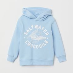 Size 6-8 Blue Cotton Hoodie With Graphic Print, H&m Casual Winter Sweatshirt, H&m Cotton Hoodie For Streetwear, H&m Cotton Sweatshirt With Ribbed Cuffs, Casual Blue Hoodie With Letter Print, H&m Cotton Hoodie Sweatshirt, H&m Cotton Sporty Sweatshirt, H&m Sporty Cotton Sweatshirt, Casual Blue Graphic Print Hoodie