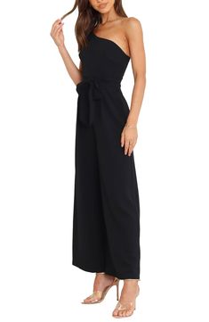 Elevate your special-occasion style with this asymmetric jumpsuit featuring a tie belt and a flowy, wide-leg silhouette. Hidden back-zip closure Asymmetric neck Adjustable strap Removable tie belt Partially lined 95% polyester, 5% spandex Hand wash, dry flat Imported Asymmetric Jumpsuit, Belted Jumpsuit, One Shoulder Jumpsuit, Fabric Gifts, Free Fabric, Black Fits, Tie Belt, Size 16, Special Occasion