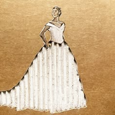 a drawing of a woman in a white dress is shown on a piece of brown paper