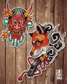 two stickers with an image of a demon and a fox on wood planks