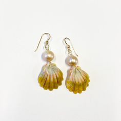 This listing is for one pair of Kauai sunrise shell & Edison pearl earrings in 14k gold fill. a whole island vibe. These earrings feature Kauai hand picked Sunrise shells paired with pastel Edison pearls on 14k gold fill ear wires. Perfect for sensitive ears and is def. an island vibe. Please note: Because all pearls & shells are unique, you will not be purchasing the exact item photographed but a similar one in quality & design. Expect slight variations in size, shape and color, as no two piece Summer 2023 Aesthetic, Gold And Pearls, Sunrise Shell, Hammered Bangles, Pacific Islander, Edison Pearls, Floating Necklace, Jewelry Beach, Rosary Necklace