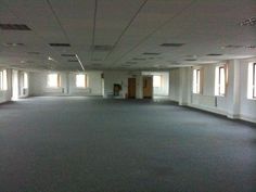 an empty room with several windows in it