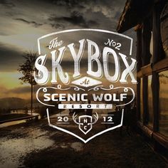 the skybox at scenic wolf resort logo is shown in front of an old building