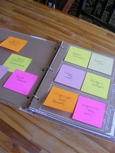 a binder with sticky notes attached to it