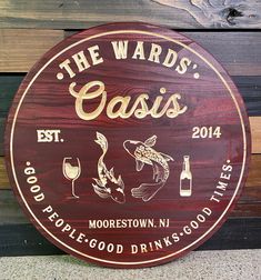 a sign for the wards oasis with fish and wine on it