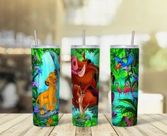 the lion king tumbler cup is shown on a table