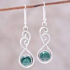 In these dangle earrings designed by Shanker of India, a round cabochon of malachite swings in an arc of sterling silver wire. Graceful swirls of the sterling silver wire at the top of the earrings create lovely and elegant shapes. Soldered Earrings, Silver Wire Jewelry, Wire Wrapped Stone Jewelry, Silver Necklace Simple, Wire Jewellery, Wire Jewelry Designs, Fancy Earrings, Diy Wire Jewelry, Wire Work Jewelry