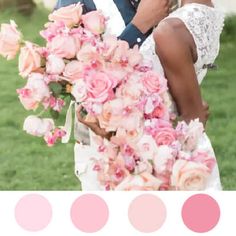 a man and woman are kissing in front of some flowers